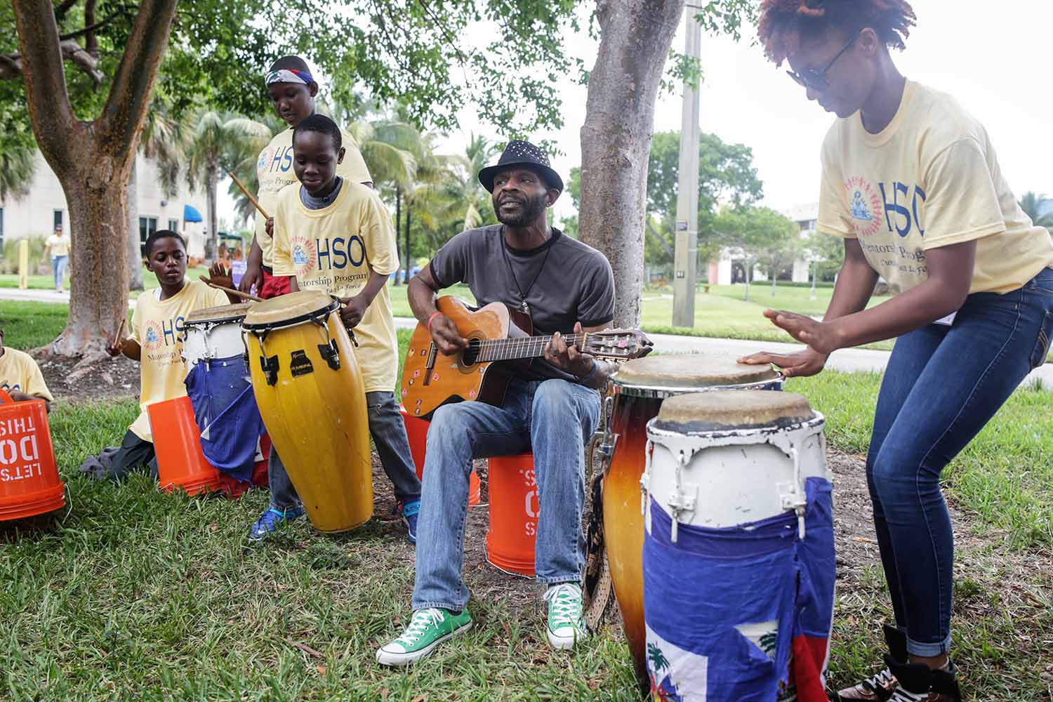 Traditional Haitian music band performing at a park